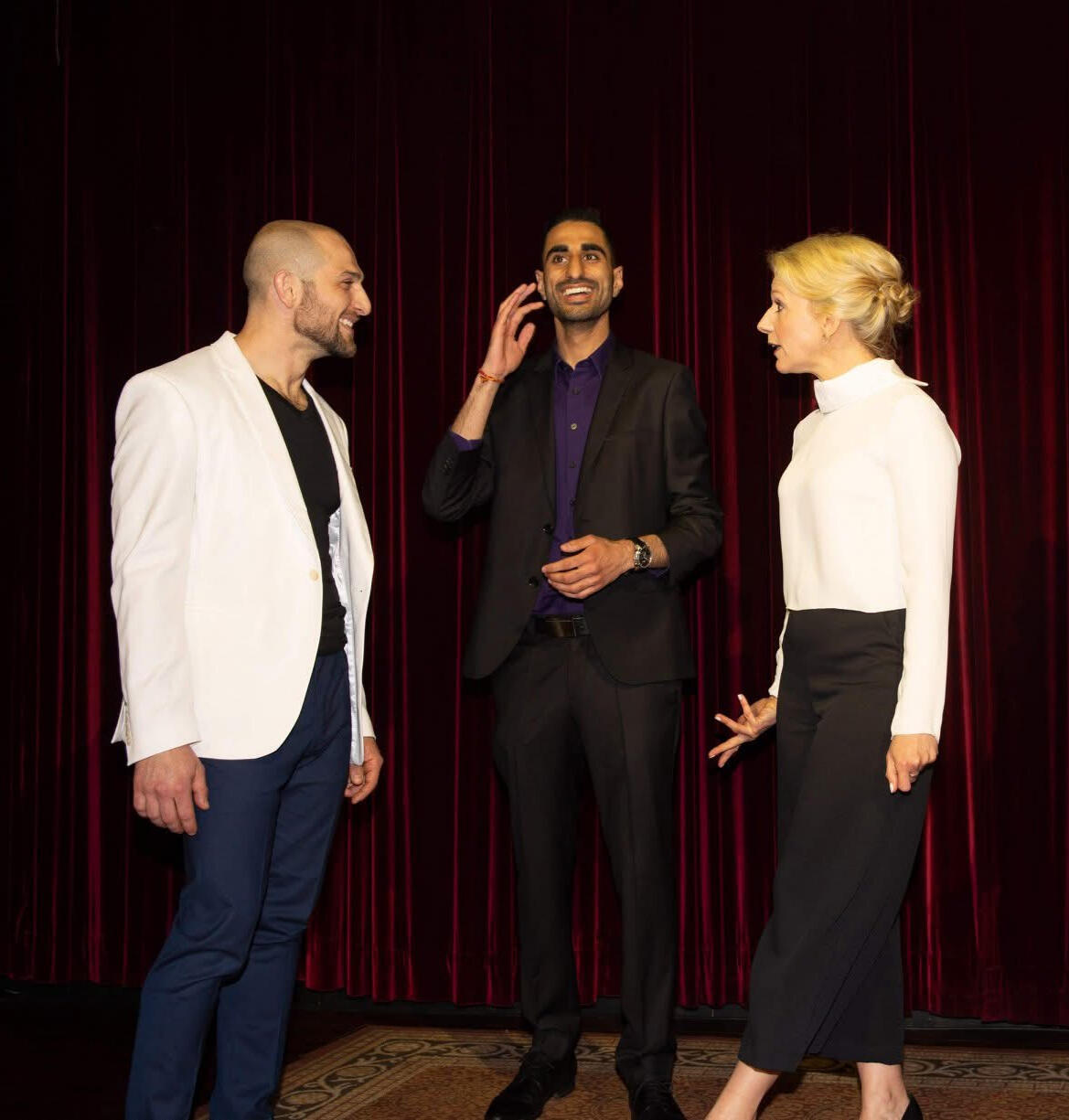 Nader Eid hosting Threshold on stage, speaking and engaging with other storytellers, live storytelling and music event in Warkworth